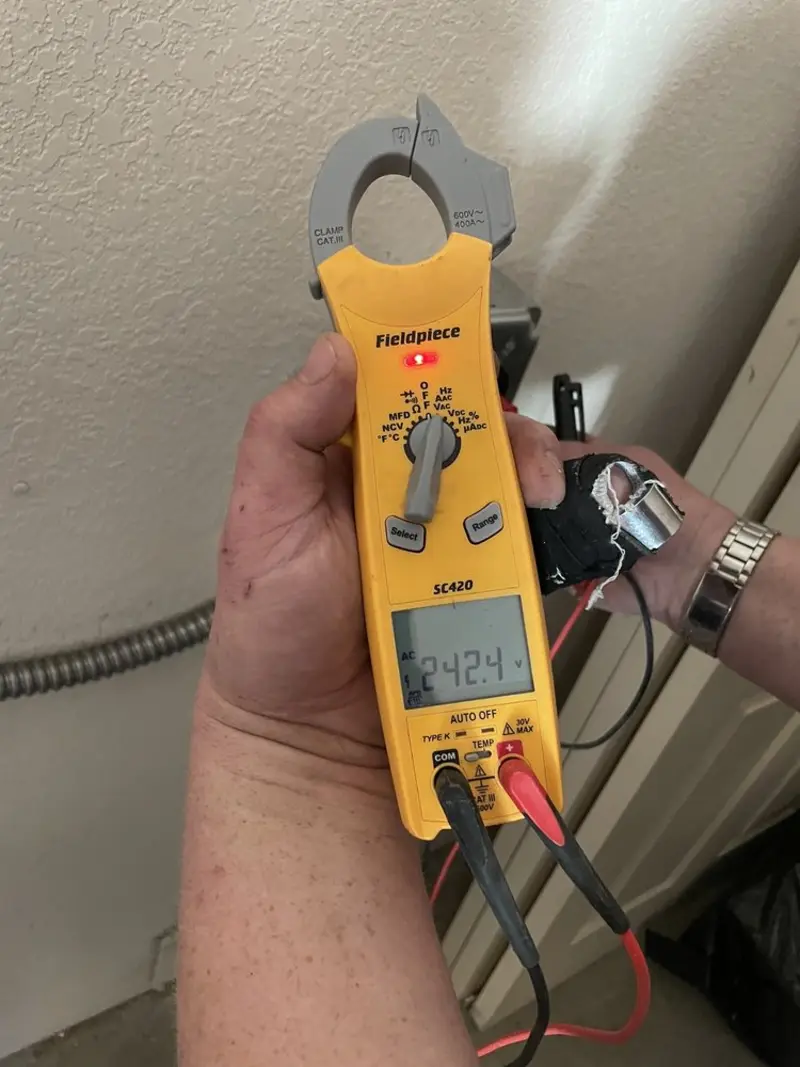 Voltage testing with clamp meter during Outlet Installation in Lakeview